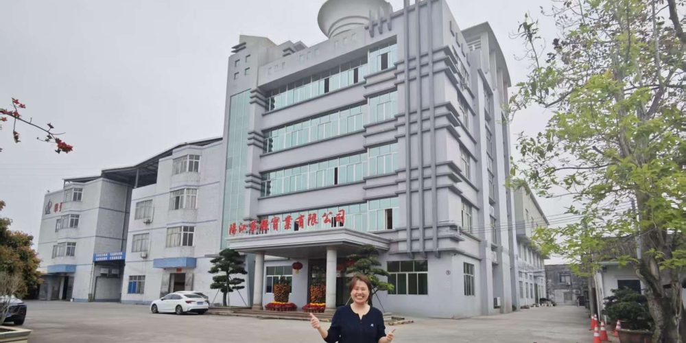 women standing in front of a factory